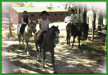 Girls in woods on horse